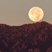 Moon rises over the Boulder Flatirons