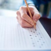 student filling a scantron test